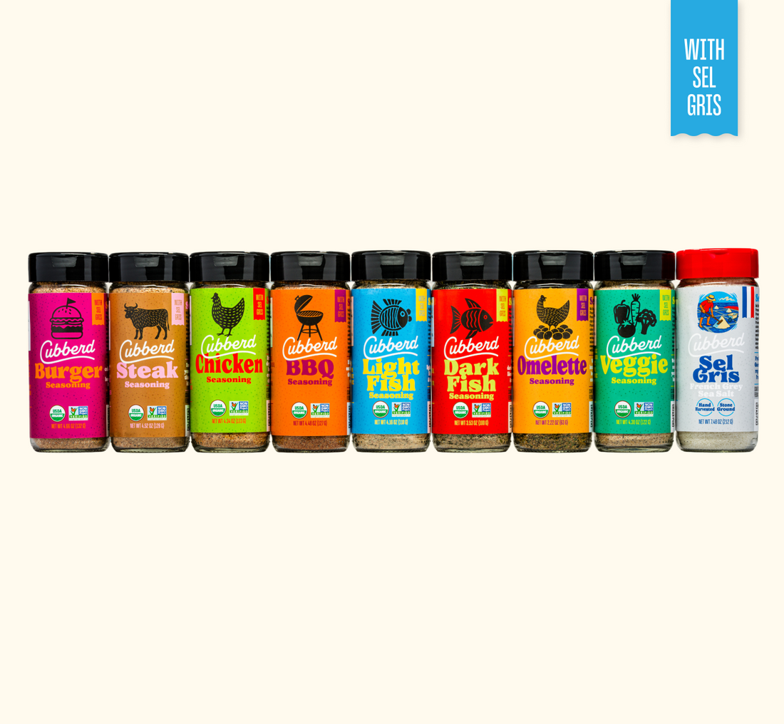 Assorted Cubberd seasoning bottles on a white background